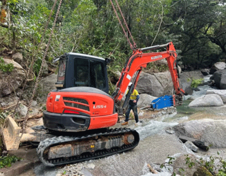 Removing a boulder after a cyclone